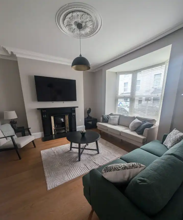 Living room decorating with fireplace by Fineline Decorators Plymouth Devon