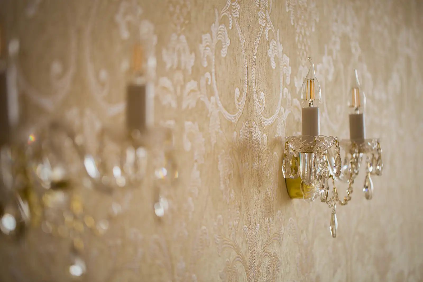 Classic patterned wallpaper with wall lights by Fineline Decorators Plymouth, Devon & Cornwall