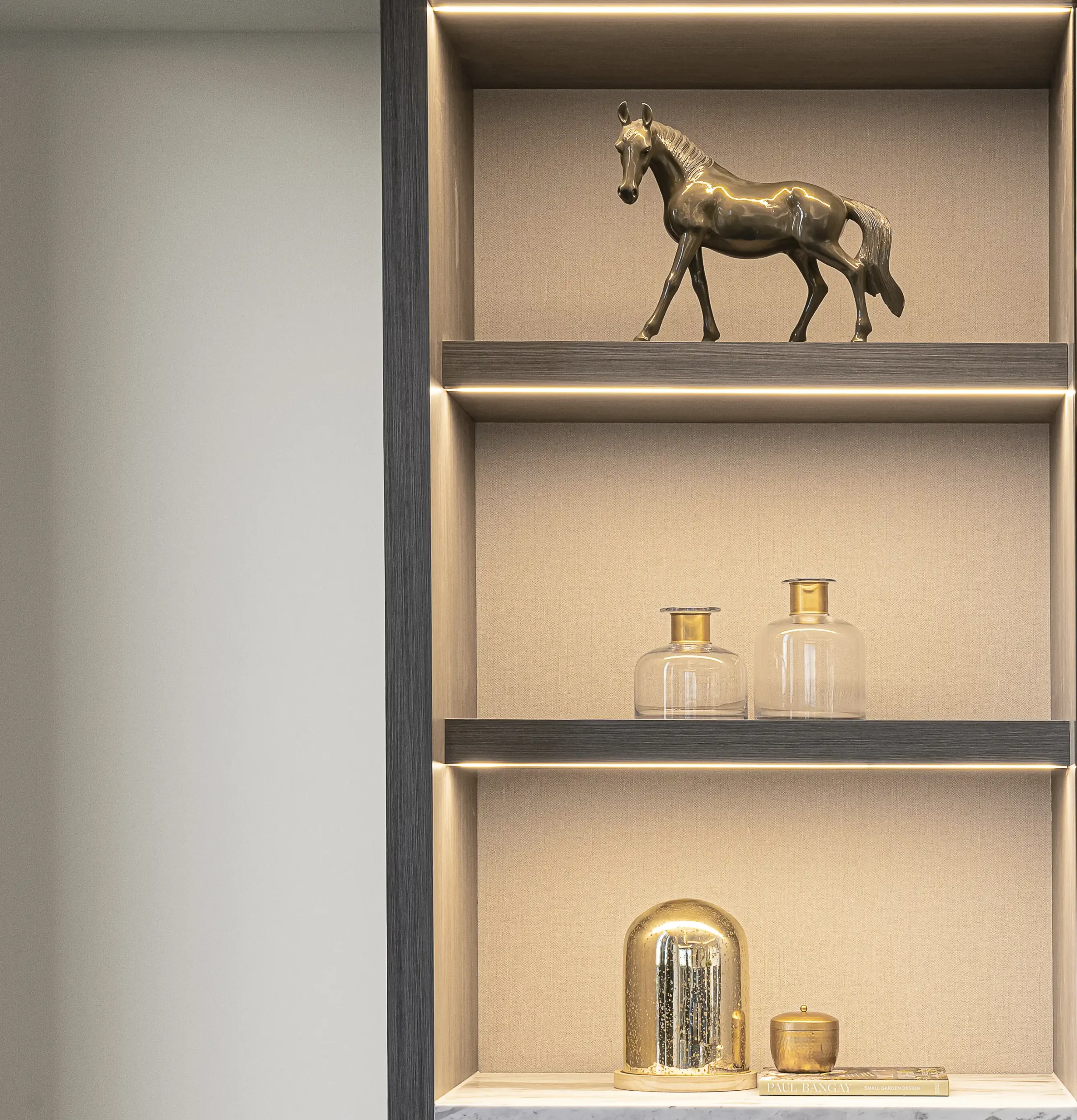 Built-in living room shelving decorated by Fineline Decorators in Plymouth and Devon