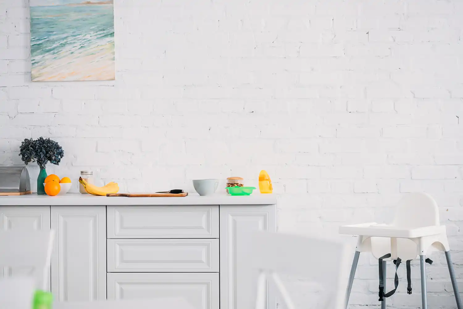White brick kitchen wall painted by Fineline Decorators Plymouth Devon